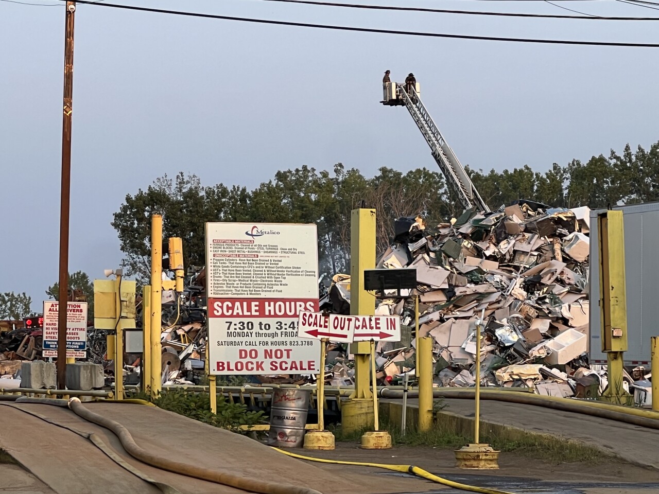 Fire crews spraying the crap metal pile from above