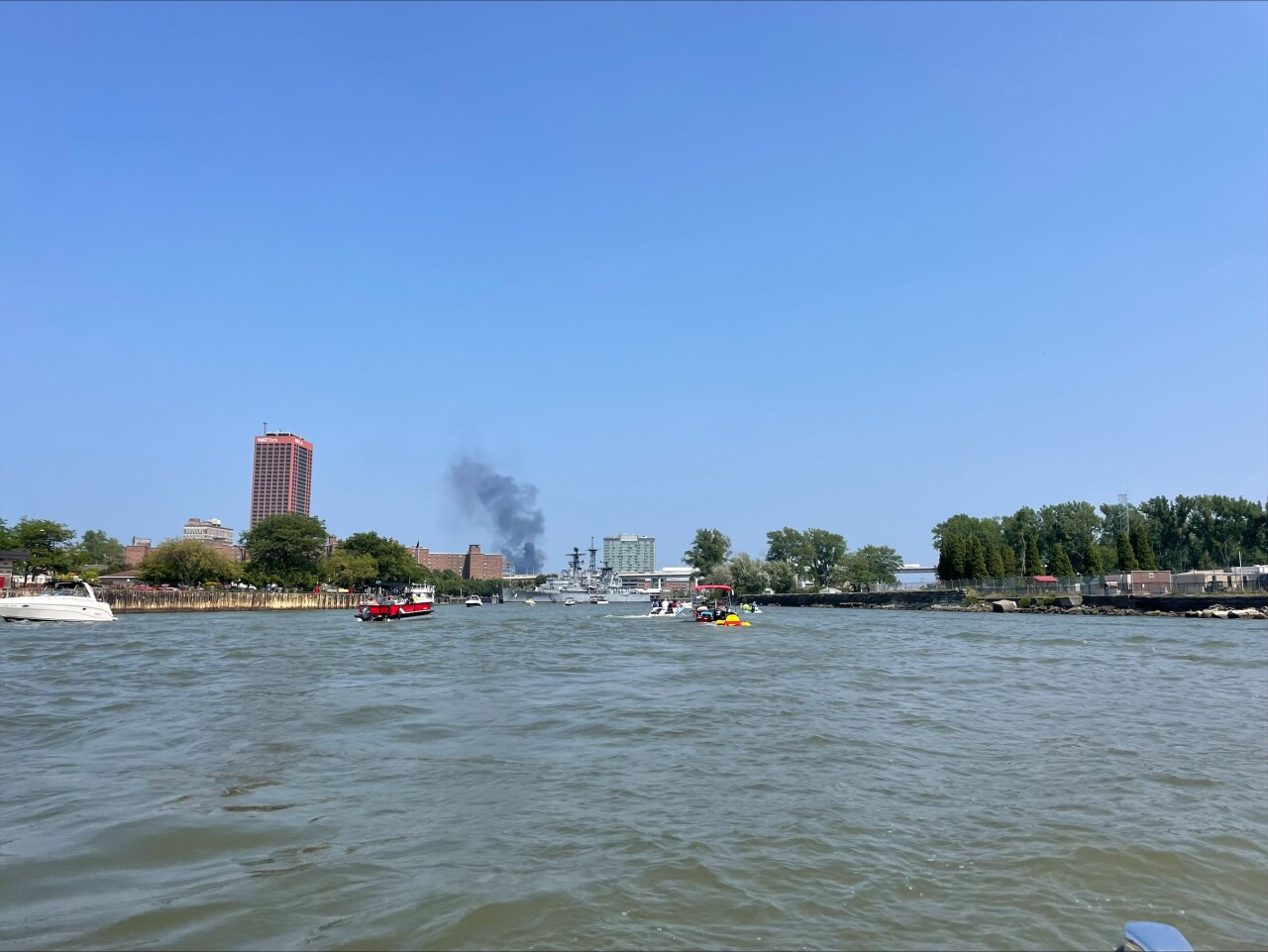 A view of the smoke entering the Buffalo sky from the water