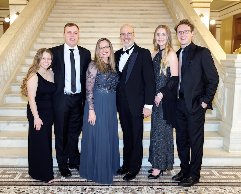 South Dakota PUC chairperson Kristie Fiegen (third from left) and her husband Tim (third from...