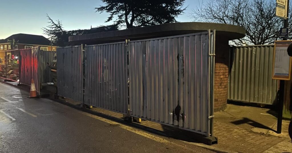 Sheringham bus shelter blocked from view with metal fencing